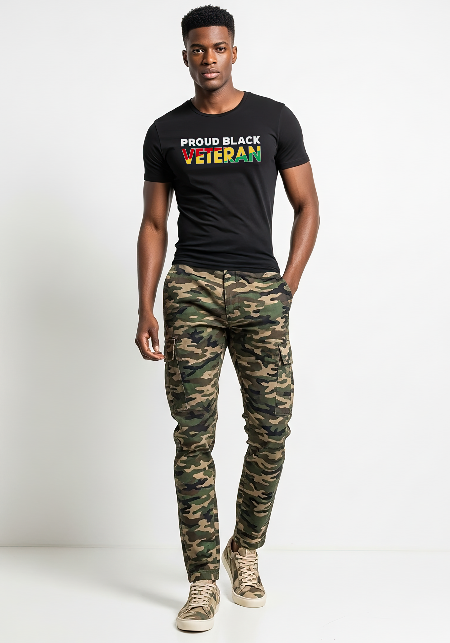Man wearing a black t-shirt with 'PROUD BLACK VETERAN' text and camouflage pants on a white background