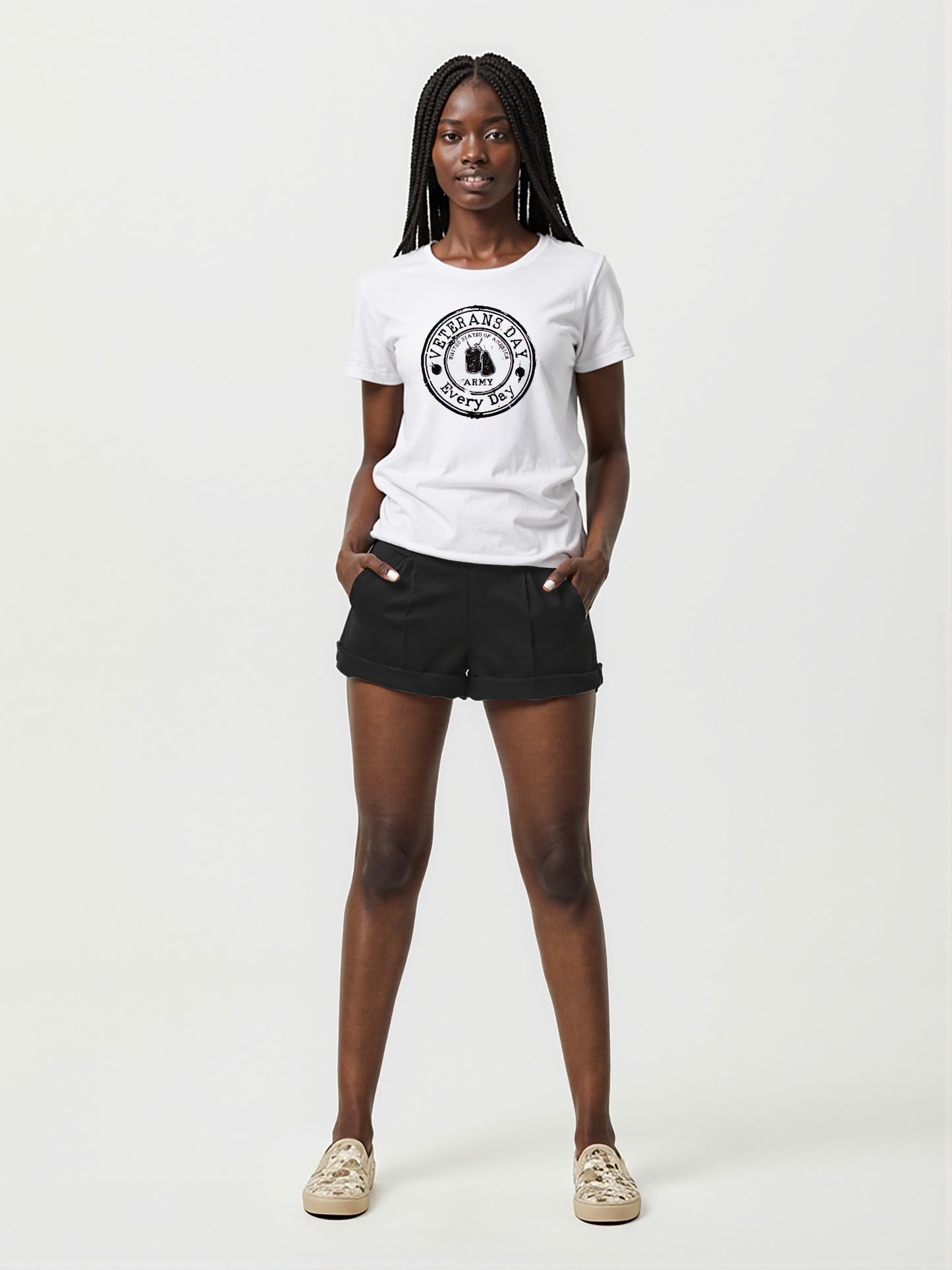 A Black woman wearing a white t-shirt with Veterans Day Every Day text and black shorts on a white background